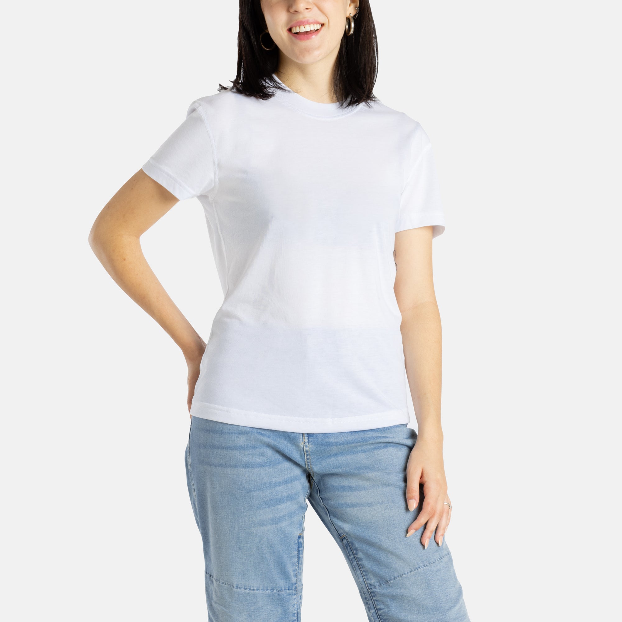 Sophia (A woman with long black hair) wears the No Limbits Adaptive Women's White Sensory Tee.