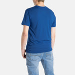 The back of a white man with short brown hair wearing a navy t-shirt.