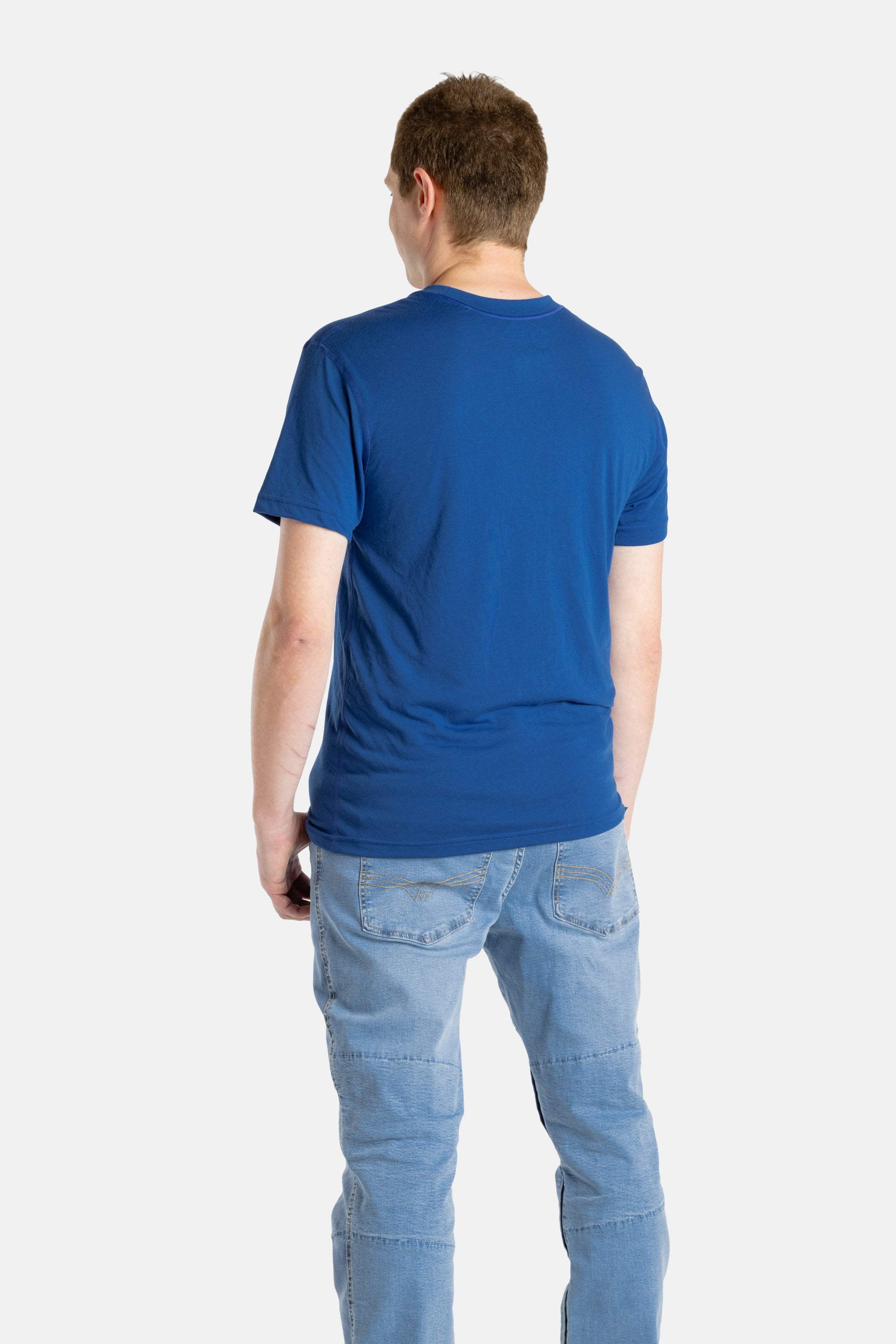 The back of a white man with short brown hair wearing a navy t-shirt.