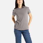 Sophia (A woman with long black hair) wears the No Limbits Adaptive Women's Charcoal Sensory Tee.