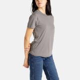 Sophia (A woman with long black hair) wears the No Limbits Adaptive Women's Charcoal Sensory Tee.