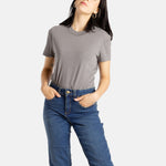 Sophia (A woman with long black hair) wears the No Limbits Adaptive Women's Charcoal Sensory Tee.