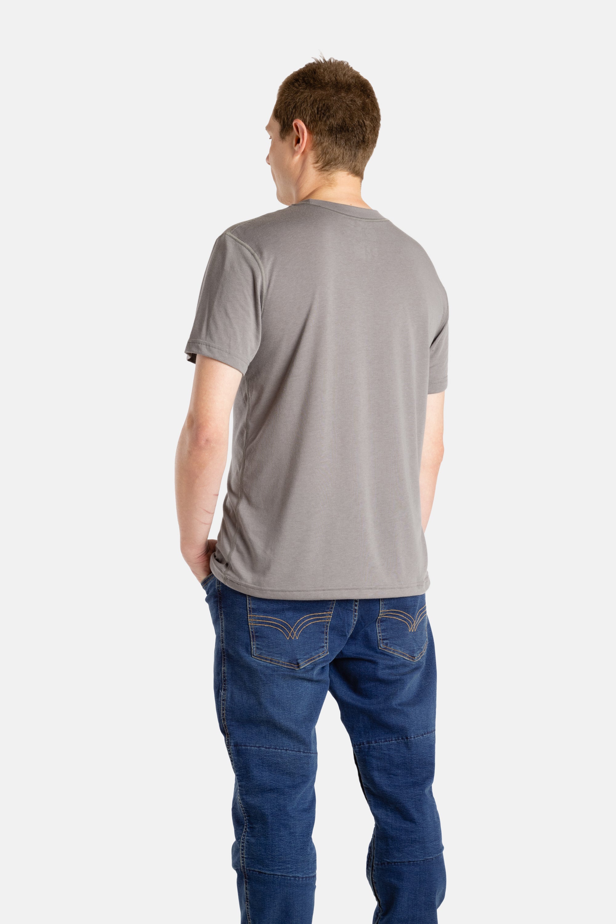 The back of a white man with short brown hair wearing a charcoal t-shirt.