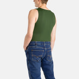 The back of a white man with short brown hair wearing an olive-green tank top and denim jeans.