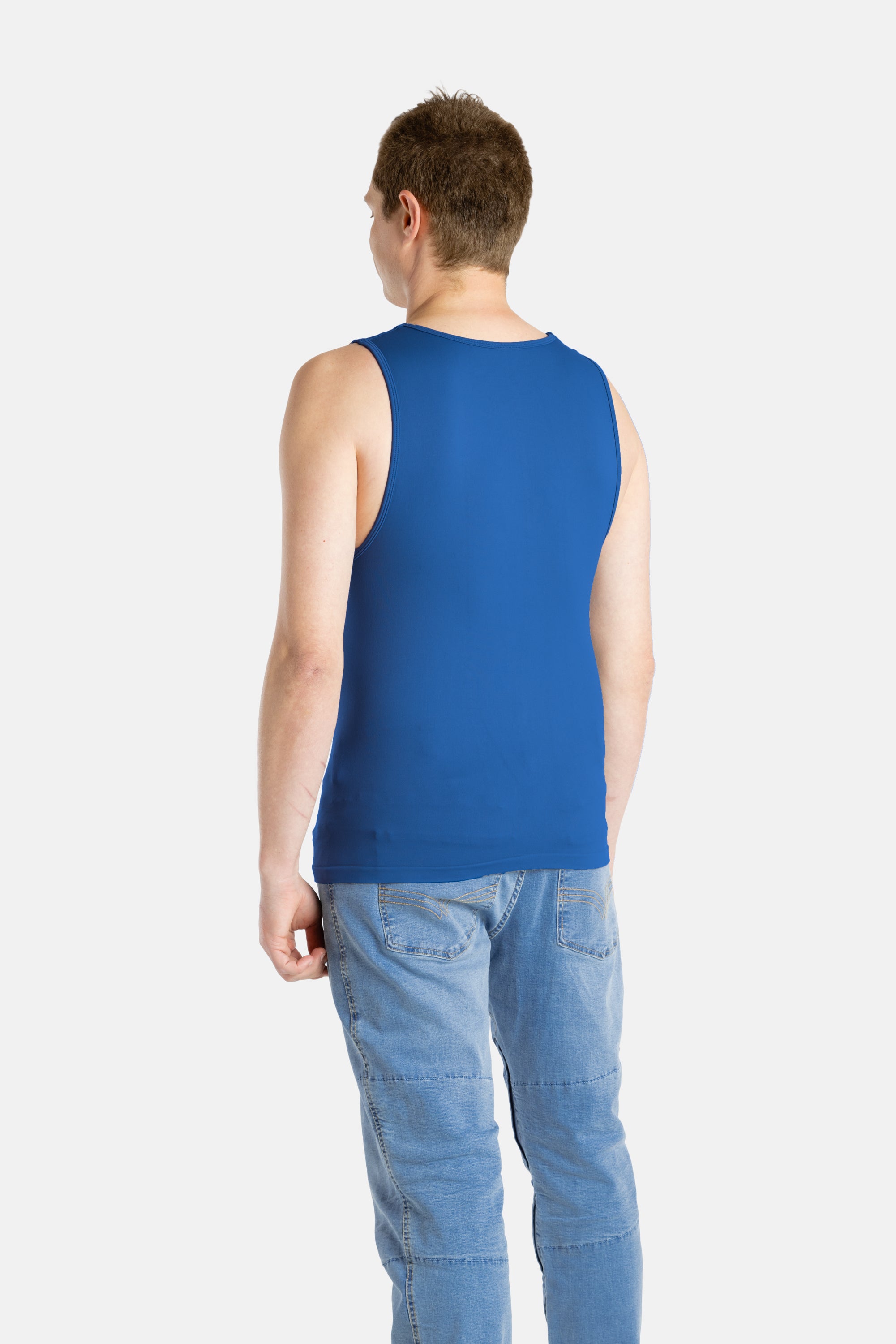The back of a white man with short brown hair wearing a navy tank top and denim jeans.