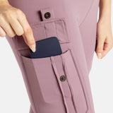 The close up of the pockets of the mauve (Pink-lavender) leggings. It's a buttoned pocket that you snap and your phone can fit.