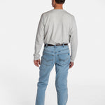 The back of a white, elderly man with a mustache wearing the Men’s Light Wash Unlimbited Pants, with a long-sleeved gray shirt, a brown belt, and brown shoes.
