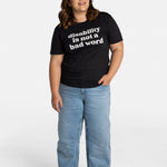 Erica Cole, the founder of No Limbits, wears the No Limbits Adaptive Women's Light Wash Unlimbited Pants. She's wearing the black "disability is not a bad word" T-shirt.