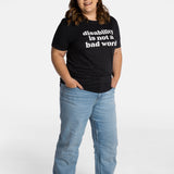 Erica Cole, the founder of No Limbits, A old white man with a black cane wears navy t-shirt with cream text that says "disability is not a bad word."