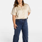 Erica Cole, the founder of No Limbits, wears the No Limbits Adaptive Women's Dark Wash Unlimbited Pants.