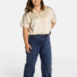 Erica Cole, the founder of No Limbits, wears the No Limbits Adaptive Women's Dark Wash Unlimbited Pants.