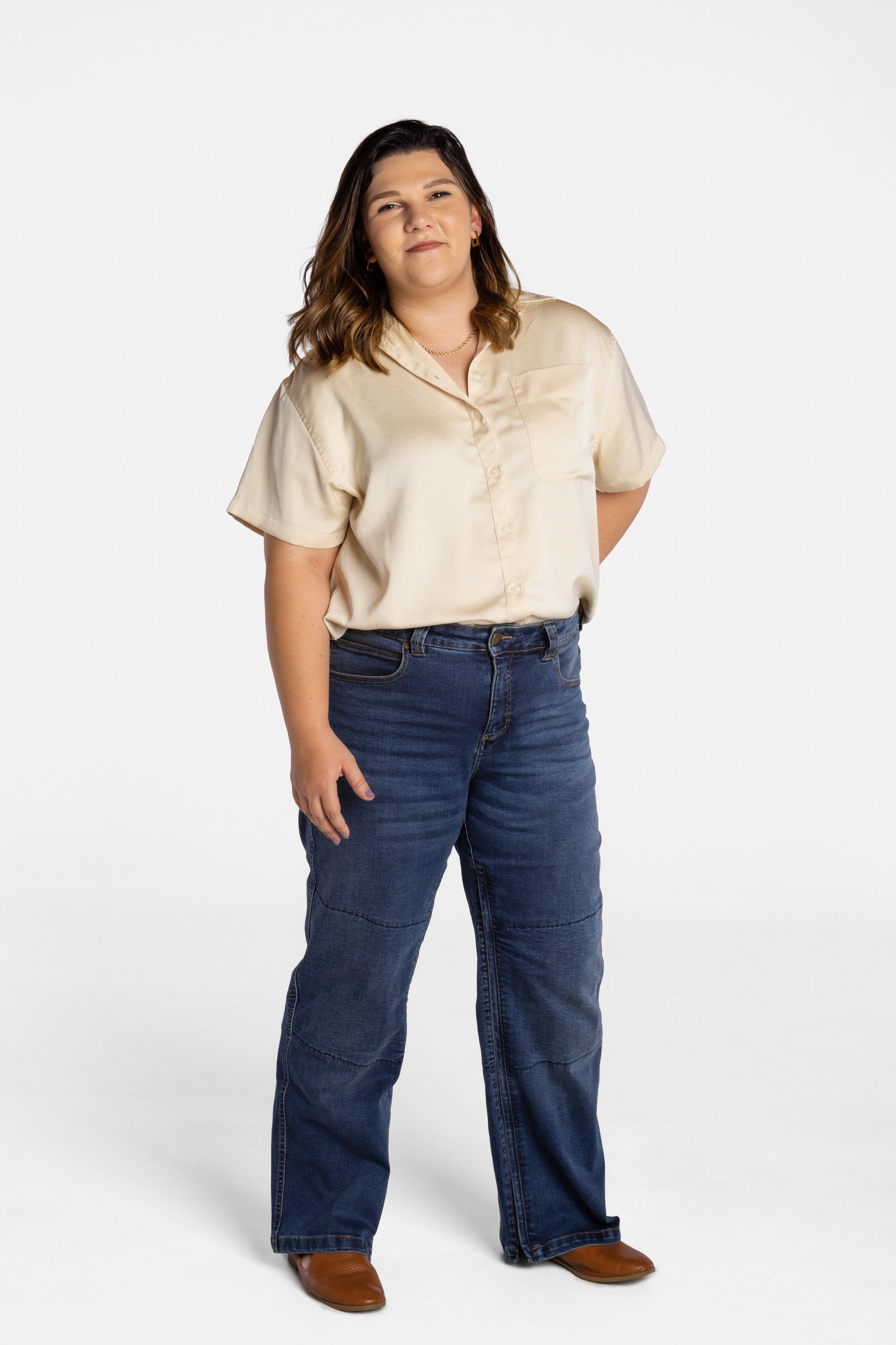 Erica Cole, the founder of No Limbits, wears the No Limbits Adaptive Women's Dark Wash Unlimbited Pants.