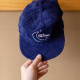 Someone puts the "Sky's the Limbits" hat on a hook.