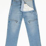 The thigh pocket from the pants unzips the whole thigh.