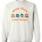 A white sweater that says “not your inspo with the four No Limbits crew members (Colorful circles with forearm crutches, a prosthetic leg, and a wheelchair.