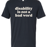 A navy t-shirt with cream text that says "disability is not a bad word."