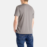 The back of a white man with short brown hair wearing a charcoal t-shirt.