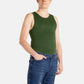 A white man with short brown hair wears an olive-green tank top and denim jeans.