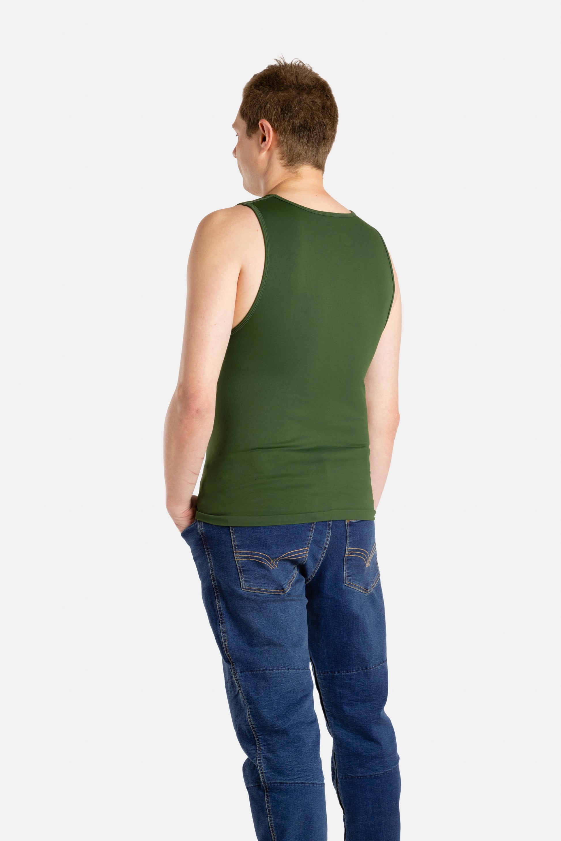 The back of a white man with short brown hair wearing an olive-green tank top and denim jeans.