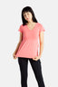 Sophia (A woman with long black hair) is wearing the No Limbits Adaptive Women's Coral Sensory Blouse with black leggings.