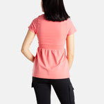 The back of Sophia (A woman with long black hair), wearing the No Limbits Adaptive Women's Coral Sensory Blouse with black leggings.
