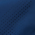 Close-up image of laser cut holed on legs of pant