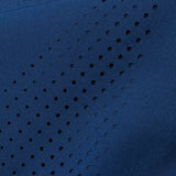 Close-up image of laser cut holed on legs of pant