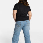 The back of Erica Cole, the founder of No Limbits, wearing the No Limbits Adaptive Women's Light Wash Unlimbited Pants.