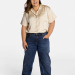 Erica Cole, the founder of No Limbits, wears the No Limbits Adaptive Women's Dark Wash Unlimbited Pants.