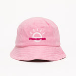 A light pink bucket hat with a white illustration of the sun and pink text that says "Unlimbited"