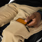 The user takes out their wallet from the pocket.