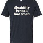 A navy t-shirt with cream text that says "disability is not a bad word."